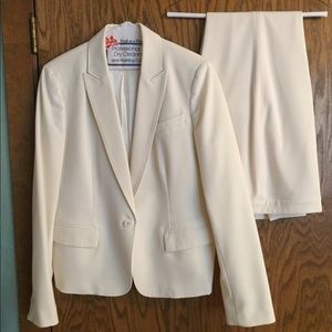 Two piece cream colored pants suit